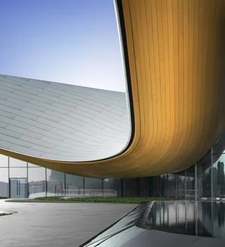 Curved aluminium facade panels on a completed building